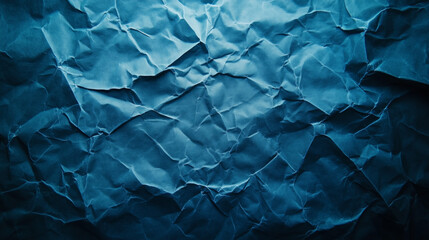 Fototapeta premium Textured blue crumpled paper background creates a visually engaging atmosphere for artistic projects and designs