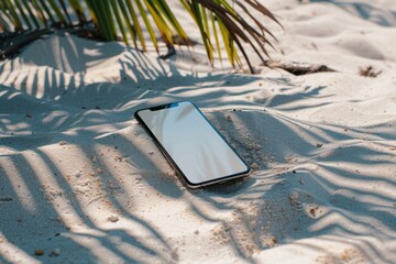 Smartphone on the sandy beach, indicating leisure and relaxation.