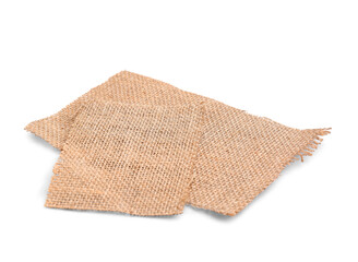 Pieces of burlap fabric on white background