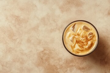 Aerial view of trendy Korean dalgona coffee in a glass Iced drink made from instant coffee and milk Summer refreshment idea with blank space