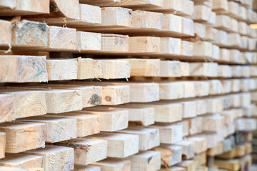 Stacked wooden planks at sawmill, closeup