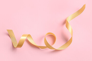 Satin ribbon on pink background