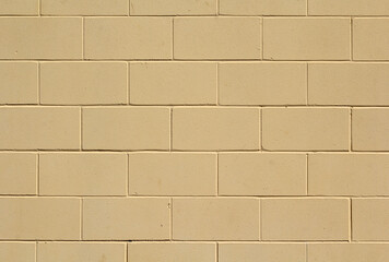 Light tan concrete block brick wall abstract textured background