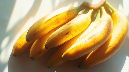 Ripe yellow bananas in sunlight.