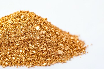 Pile of gold colored sand is on a white background