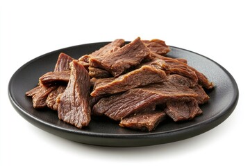 roast meat beef fillet strips on black plate isolated over white background