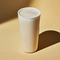 Fototapeten Nutritious protein shake in a shaker. Featuring vanilla and almond milk © ArpPSIqee