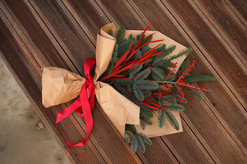 Christmas bouquet with fir, branch with red berries and red leaves, Christmas decoration
