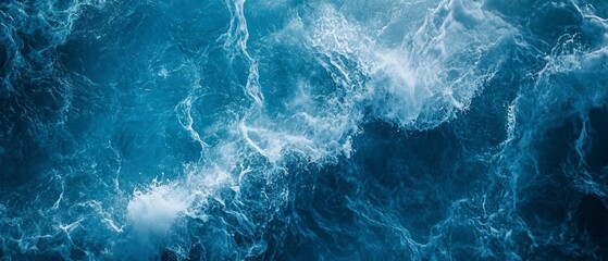 Fototapeta premium Aerial view of ocean waves with whitecaps.