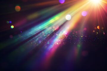 Fototapeta premium Colorful light rays and bokeh on dark background. (1)