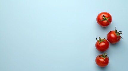 Fresh red tomatoes on blue surface food photography minimalist style