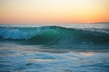 Fototapeta premium Ocean wave breaking at sunset.