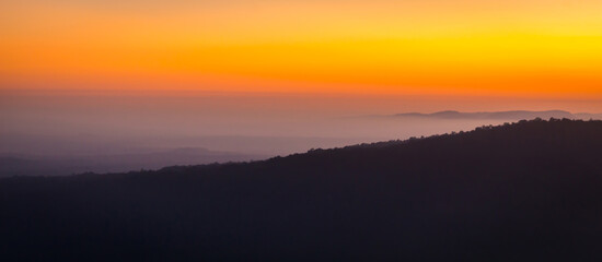 Sunrise in the mountains, panorama landscape, natural background, Preah Vihear Thailand.Mist in the morning.Aerial view of Morning sunrise above the mountains with mist around , Mountains fog.