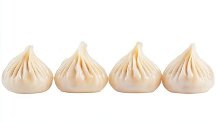 Obraz premium Four delicious steamed buns, arranged in a row against a white background.