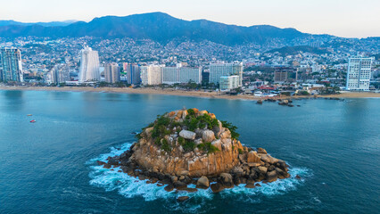 Aerial view of the bay of Acapulco from the rocky island Farallon del Obispo, located in front of the classic hotel zone of this Mexican tourist destination.