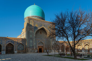 View of Tillya-Kari Madrasah and domed mosque building in the northern part of Registan Square on a...