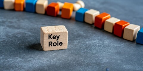 Key Role Concept with Wooden Blocks on Stone Background Leadership and Strategy in Business
