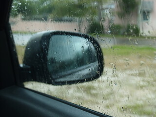 mirror of car in the rain