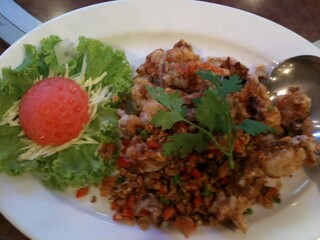 Fried Soft Shell Crab with crispy garlic in white plate
