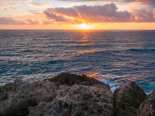 Coastal Sunrise Over Rocks