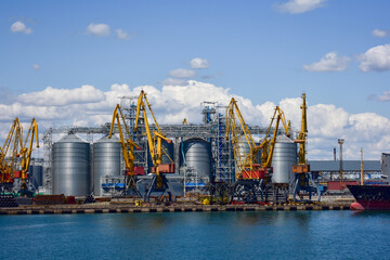 Construction of silos in the port. Grain factory. Grain delivery by ship