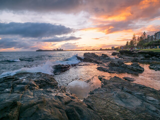Golden Seaside Sunrise with Reflections