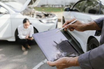 Insurance agents assist clients in an outdoor setting after a car accident, inspecting the vehicle for damage, discussing policy coverage, repair options, liability, and pursuing a claim.