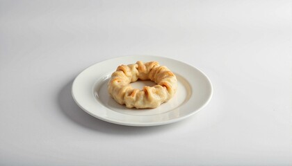 Minimalistic mandu dish on white plate, contemporary dining inspiration