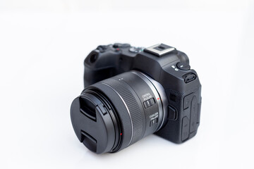 Fototapeta premium Mirrorless interchangeable lens digital full frame professional photo and video camera with lens.
