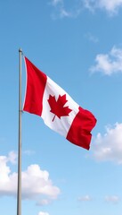 Canada flag waving in front of mountain landscape.Canada Day, patriotic theme, national celebration, flag display, mountain backdrop.National pride, Canada, mountains, peaceful wilderness, unity.
