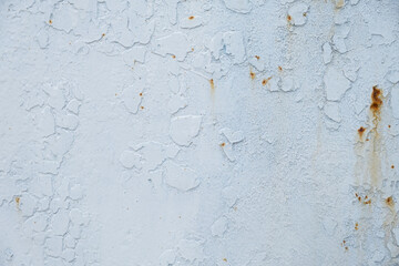 The texture is white paint on metal. Abstract background for the design. Aged metal with rust painted with white enamel. Authentic conceptual retro background. Sheet metal macrophotography. Copy space