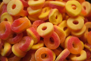 many gummy candies heap background