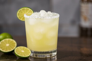 Fototapeta premium Frozen lime margarita with a salted rim, served in a chilled glass, perfect for a refreshing cocktail showcase