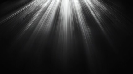 Bright light rays on black background.