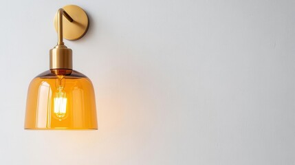 Obraz premium A retro wallmounted sconce with a bellshaped amber glass shade and brass arm