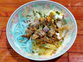 Soto Ayam in Indonesia. Soto ayam is a traditional Indonesian dish that uses ingredients such as shredded chicken, potatoes, eggs, rice vermicelli, bean sprouts with a delicious sauce.
