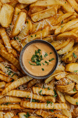 Delicious grilled steak served with crispy fries and roasted tomatoes on a white plate