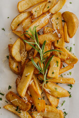 Delicious grilled steak served with crispy fries and roasted tomatoes on a white plate