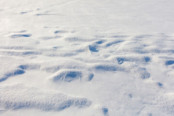 The snow is white and the ground is covered in it