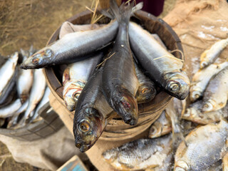 A basket of fish is displayed on a table