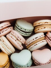 Heart-shaped arrangement of pastel macarons bakery food cozy setting close-up sweet treat concept