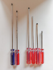 Slotted screw driver and phillips screw driver red and blue colors isolated on white background