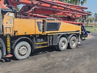 Concrete Pump Long Vehicle Used For Pumping Concrete From Ground To Roof Top Floor. Auto Concrete Pump Truck, Advanced Technology Remote Control Pump Used For Delivery Of Concrete From Mixture To Site