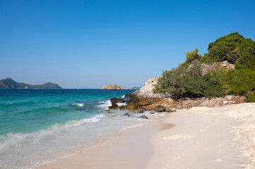 Beautiful seascape with big rock, sand beach, tree and mountain of  beautiful seascape at Koh Samaesarn, Chonburi, Thailand