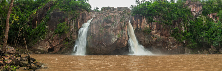 Panoramic beautiful deep forest waterfall in Thailand. nature background.