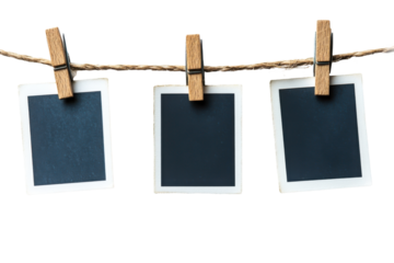 Three blank photo frames hanging on a clothesline isolated on transparent background