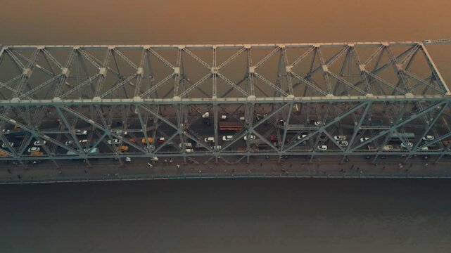 Aerial view of Kolkata Iconic Howrah Bridge or Rabindra Setu over Ganga River during Sunset