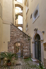 A street among the old houses of a historic district of the city of Gaeta, Italy.