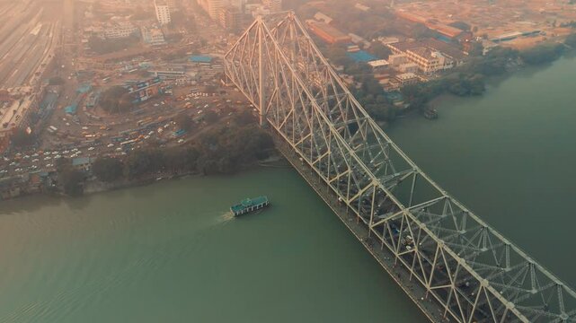 Aerial view of Kolkata Iconic Howrah Bridge or Rabindra setu over Ganga River during Early Morning