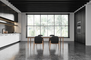Modern kitchen interior with dining area and large window view of greenery. 3D Rendering